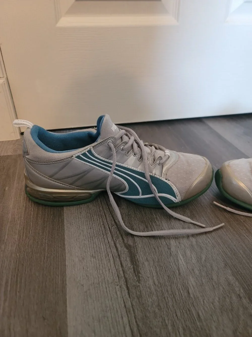 Womens grey and blue puma tennis shoes - has damage - size 10